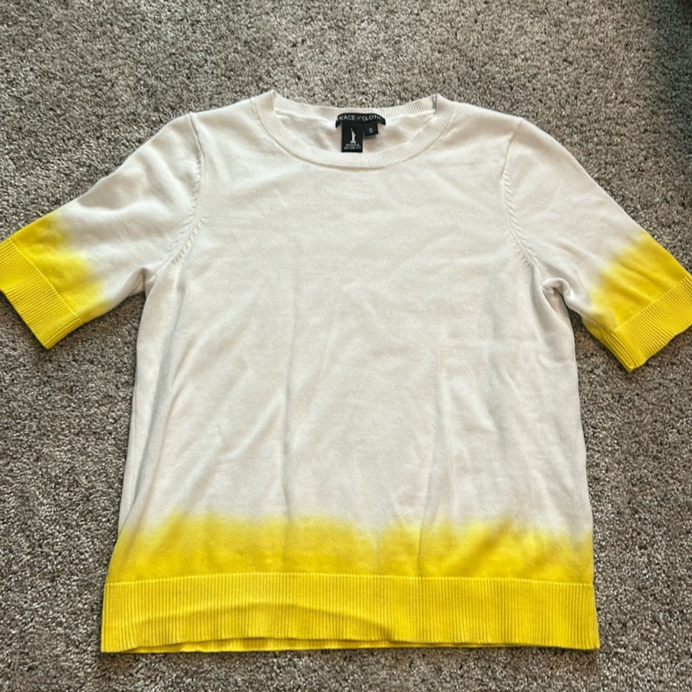 White and yellow short sleeve top.
